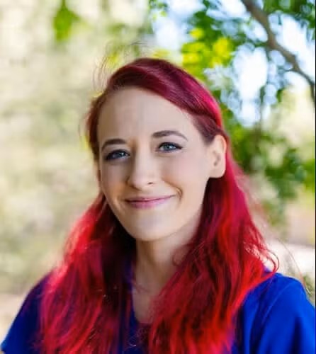 women smiling outside with red hair